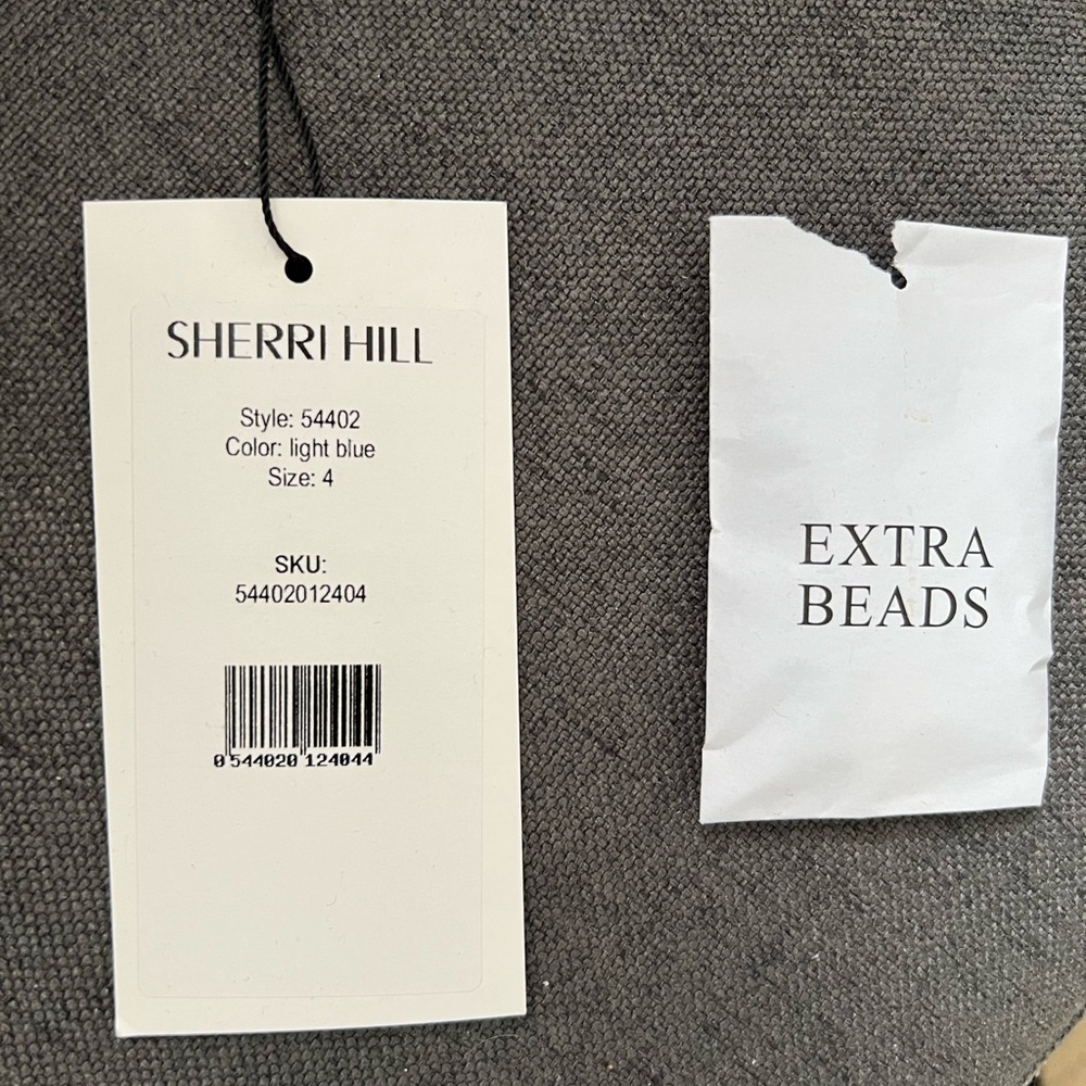 Worn once February 2022, dry cleaned, light blue Sherri Hill